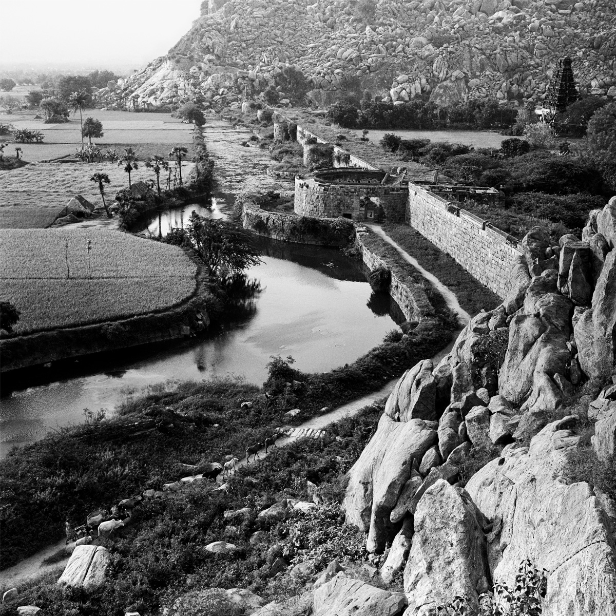 View across fields and remains of the old fort wall, Gingee, Tamil Nadu.