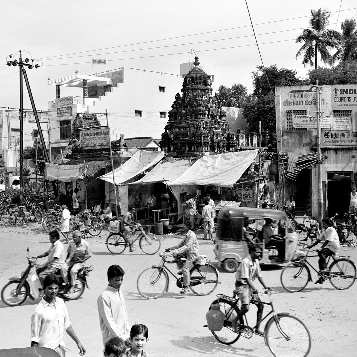 Busy intersection on Nellukkara Street, Kanchipuram, Tamil Nadu.