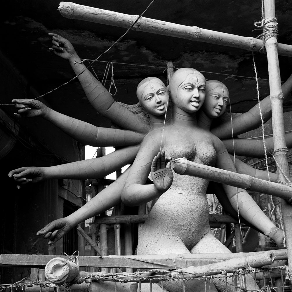 Three-headed Kali sculpture being prepared for the Kali festival in a workshop in the Kumartuli neighborhood, Kolkata, West Bengal.