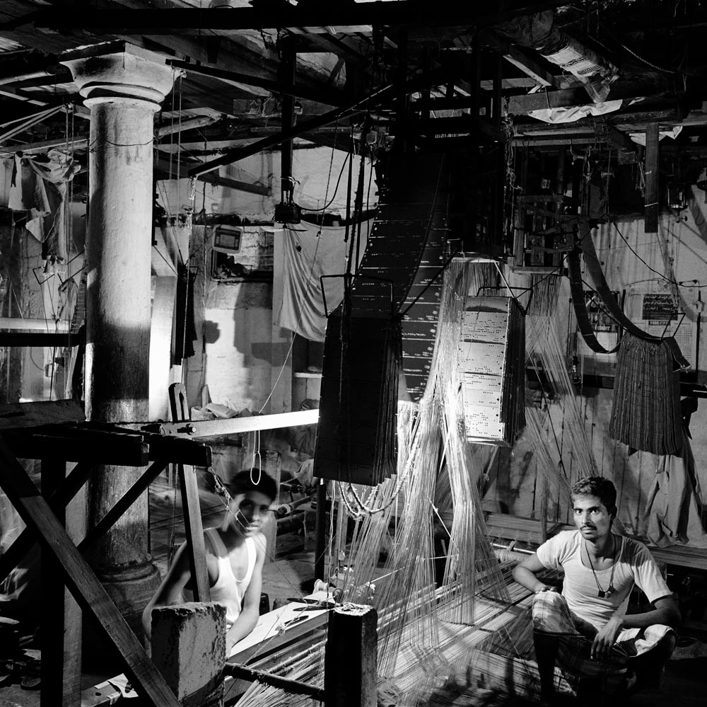 Sari weavers in their workshop, Varanasi, Uttar Pradesh.