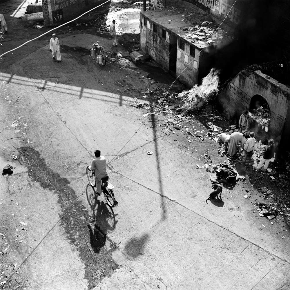 Trash fire near the bathing ghats, Nasik, Maharashtra.